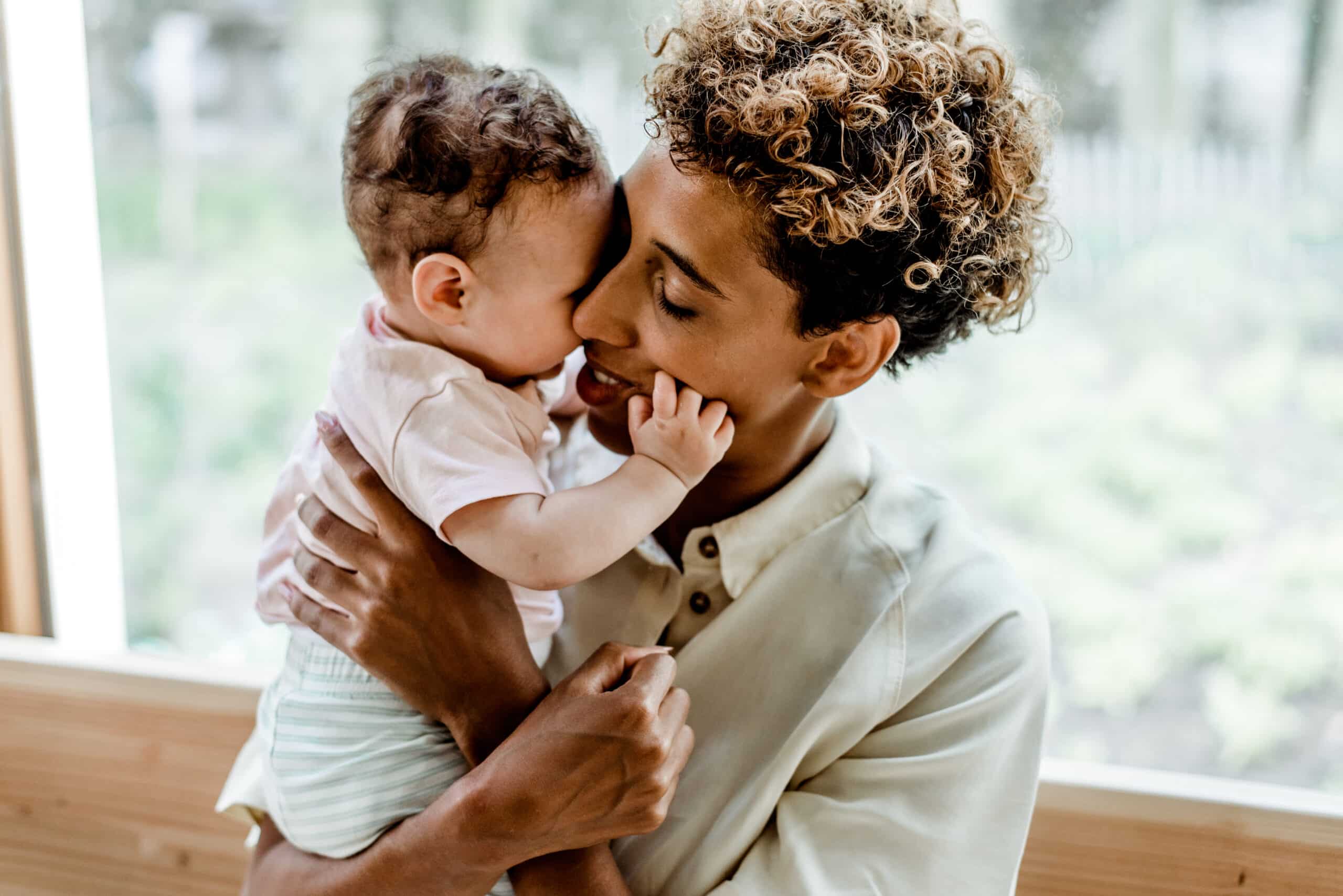 Mom hugging her baby